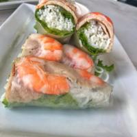 4. Goi Cuon · 2 Rolls. Steamed shrimp and pork wrapped in a rice paper, lettuce, and vermicelli served wit...