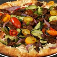 California Roasted Veggie Pizza · Housemade marinara sauce, mozzarella, baby heirloom tomatoes, roasted red onions, fresh bell...
