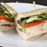 Turkey Sandwich · Natural oven roasted turkey, provolone, cranberry sauce, mixed greens, Roma tomatoes, mayo, ...