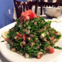 Tabouleh Salad · Parsley, tomatoes, bulgar wheat with lemon and olive oil.