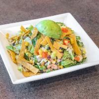 Santa Fe Chicken Salad · Green leaf lettuce, corn, black beans, diced tomatoes, red onions, avocado, tortilla strips,...