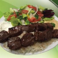 Beef Kebobs Plate · 100% tender beef. Includes salad, hummus, garlic paste, potatoes, pickles, turnip, pita brea...