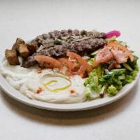 Kafta Kebobs Plate · Kafta (ground beef, onion, parsley and spices). Includes salad, hummus, garlic paste, potato...
