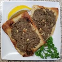 Safeeha (Meat Pie) · A blend of ground beef and several seasonings top a homemade dough are used to make this del...