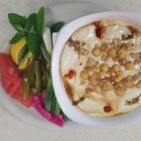 Fattat Hummus · Fried pita chips topped with a special blend of hummus, and other ingredients.