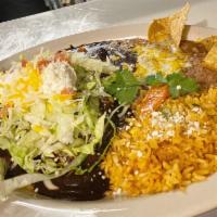 Two Enchiladas Plate · Served with your choice of red sauce, green sauce, or mole sauce. Topped with sour cream, le...