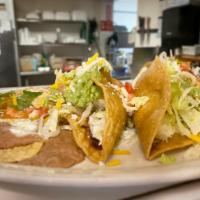 Two Tacos of your choice Plate · Served on crispy or soft tortillas with guacamole, sour cream, lettuce and cheese. Served wi...