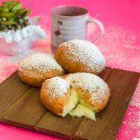 Custard Ponchik · Ponchik with Custard filling and Topped with Powdered Sugar. 