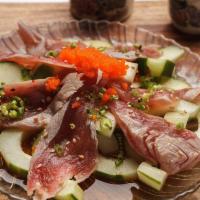 Tuna Tataki Salad · Seared tuna with cucumber and seaweed salad. Topped with ponzu and spicy sauces.