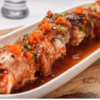 Mexico Roll · Spicy tuna, avocado, crunch and seared tuna, topped with seared salmon, barbecue eel, eel sa...