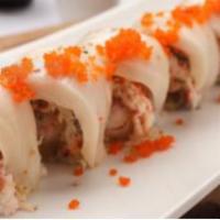 White Dragon Roll · Barbecue eel, snow crab and seared white tuna, topped with smelt roe, ponzu sauce and chili ...