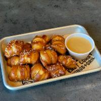 Pub Pretzels · Soft pretzels served with your choice of East Coast Wings and Grill signature bourbon honey ...