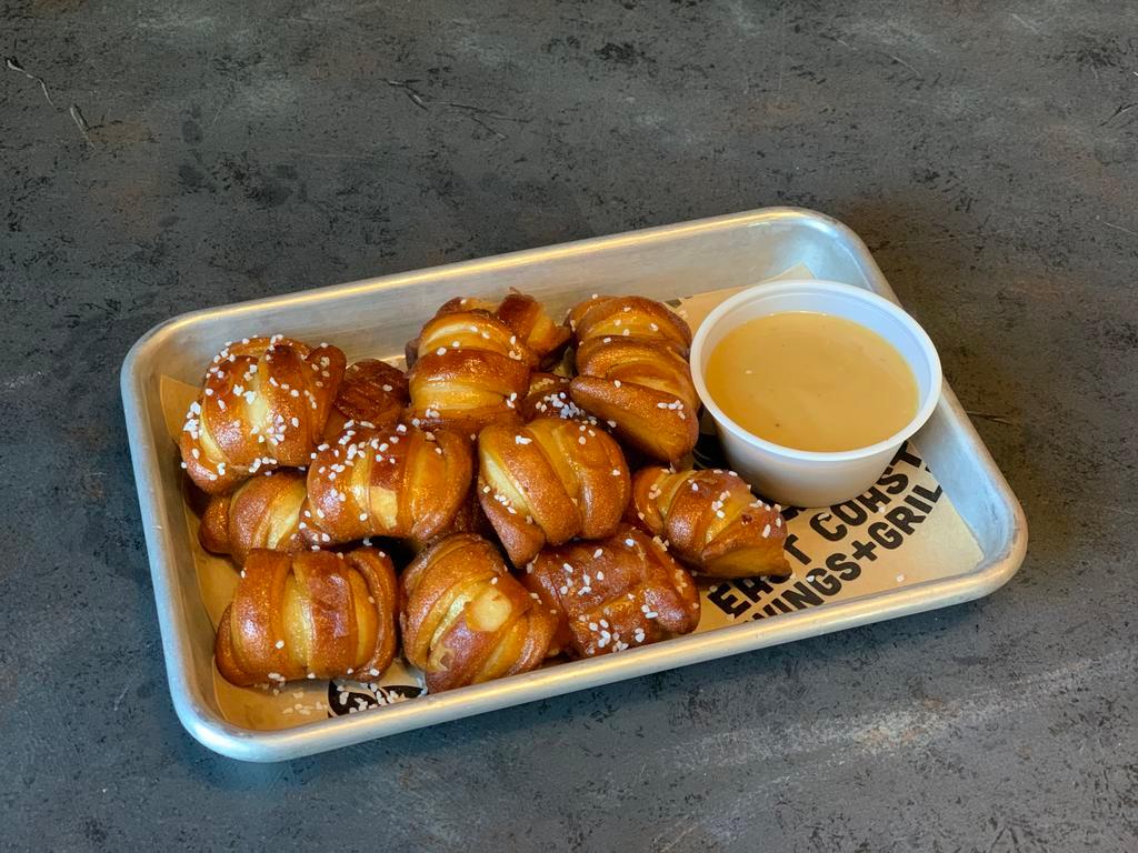 Pub Pretzels · Soft pretzels served with your choice of East Coast Wings and Grill signature bourbon honey mustard or East Coast Wings and Grill signature craft beer cheese.