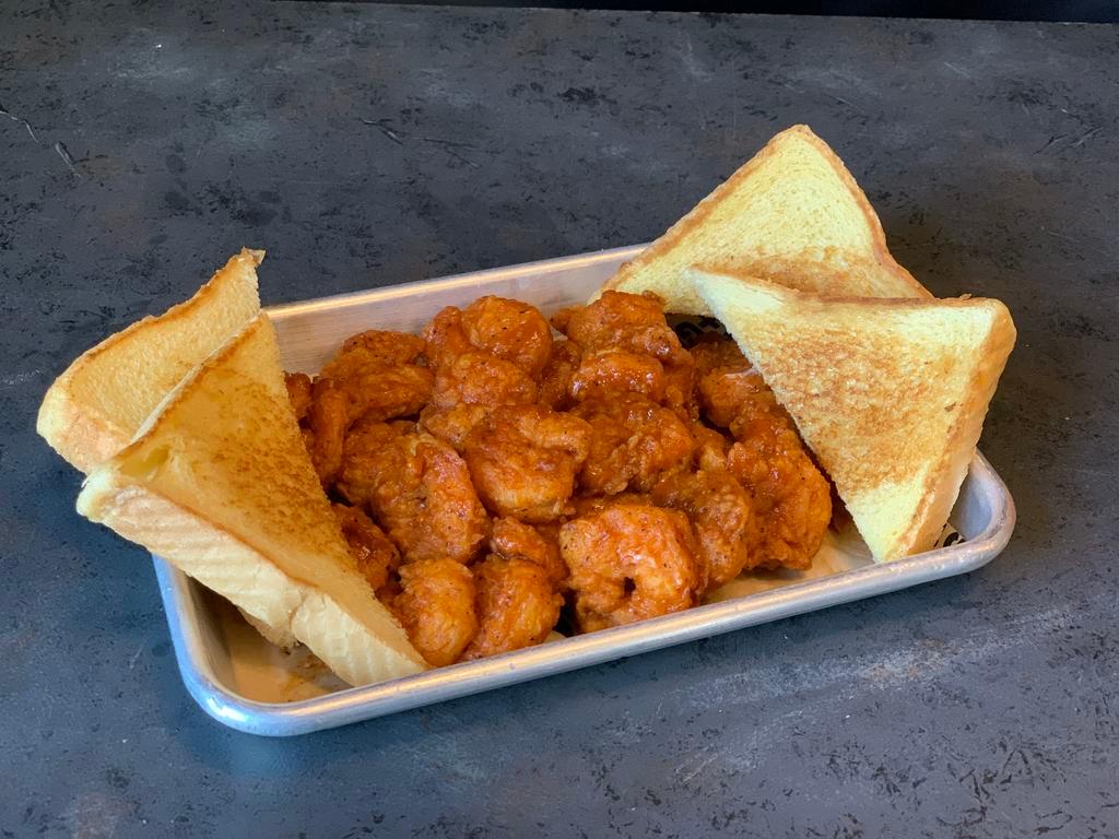 Buffalo Shrimp · Hand-breaded or grilled and tossed in your choice of our national award-winning wing sauce (choose from mild, medium, hot or x-hot). Served with Texas toast, celery and carrots.