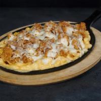 Chicken Mac and Cheese Skillet · Our signature mac and cheese mixed with crispy chunks of chicken breast then topped with Moz...