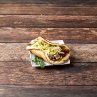 Gyro · Served on a Greek pita with a choice of lamb, beef, chicken or falafel (vegetarian) topped w...