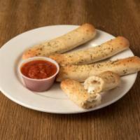 Bosco Sticks · Fresh baked breadsticks stuffed with mozzarella cheese and served with marinara.