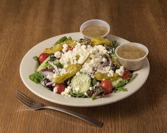 Greek salad · Mixed greens, tomatoes, cucumbers, red onions, kalamata olives, pepperoncinis and feta cheese with our homemade Greek vinaigrette.