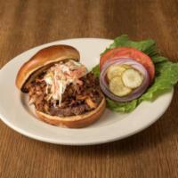 Little Piggy Burger · Our juicy 1/2 lb. burger topped with pulled pork, thick sliced bacon and creamy coleslaw acc...