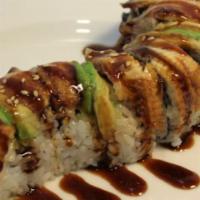 Dragon Roll · Inside crabmeat, avocado and cucumber. Topped with grilled eel, avocado and eel sauce. Serve...