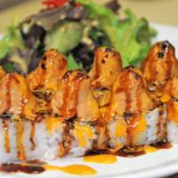 Volcano Roll · Inside crabmeat, cucumber and avocado. Topped with baked spicy tuna, eel sauce and spicy may...
