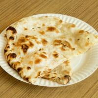 Plain Naan · Leavened bread baked in tandoor with white wheat flour.