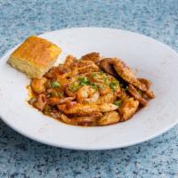 Jambalaya · Chicken, shrimp, Andouille sausage, peppers and onions over dirty rice with cornbread. *Glut...
