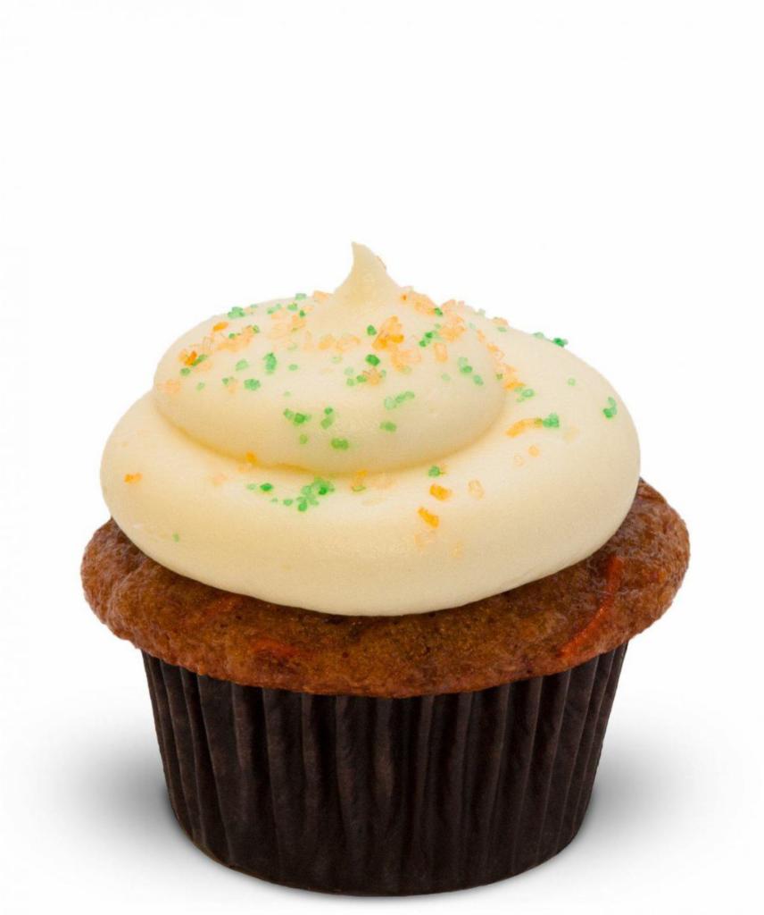 Carrot Walnut Cupcake · Carrots, golden raisins , walnuts, cream cheese frosting. Sink your teeth into some good, old-fashioned yum. Our carrot walnut cupcake is packed with fresh carrots, toasted walnuts, golden raisins and crushed pineapple. It's topped with a swirl of decadent cream cheese frosting and colorful sanding sugar.