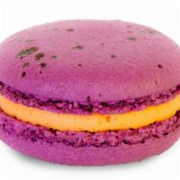 Passion Fruit · Purple splatter biscuits filled with passion fruit buttercream and a passion fruit curd cent...