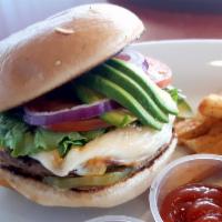 Chulla’s Crafted Burger · Served with pickles, lettuce, tomato, red onion, avocado, bacon and cheddar cheese.