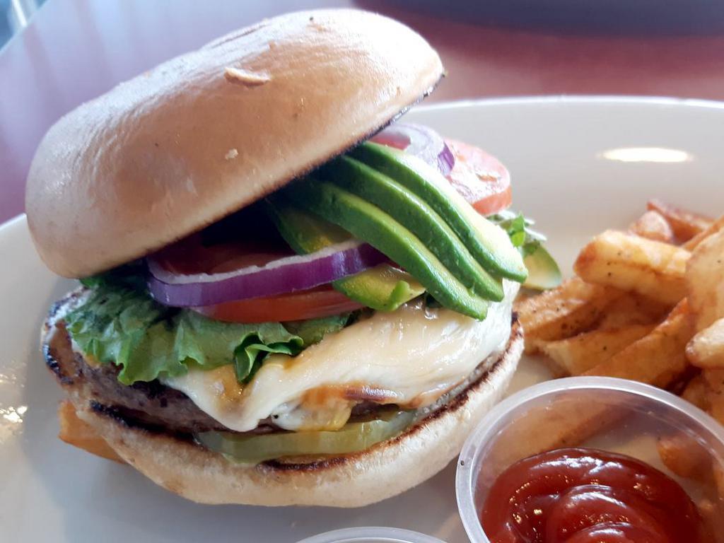 Chulla’s Crafted Burger · Served with pickles, lettuce, tomato, red onion, avocado, bacon and cheddar cheese.