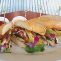 Makona Chicken Sandwich  · Served with pickles, lettuce, tomatoes, red onion, avocado, bacon, Swiss cheese and signatur...