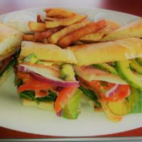 Chulla’s Turkey Sandwich · Served with pickles, bacon, lettuce, tomato, red onion, avocado, Swiss cheese and signature ...