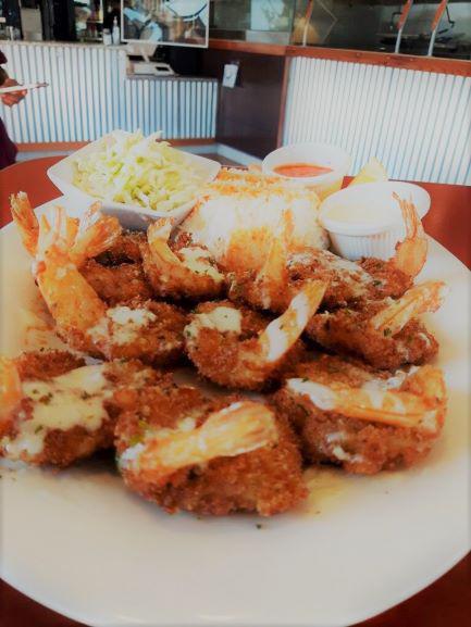 10 Coco Loco Shrimp · 10 pieces. Shrimp breaded with coastal spices, white rice and coleslaw with Guerrero lime and Aztec chili sauce.