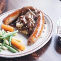 Bangers n Mash · We grill these locally made, British style pork bangers and place them atop our naughty mash...