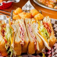 Da Club · Sliced ham, bacon, turkey, Swiss, and Cheddar cheese with tomato and mayonnaise. Served on t...