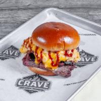 Mac N Brisket Sandwich  · Delicious smoked brisket, topped with mac and cheese, cheddar cheese and BBQ sauce. 