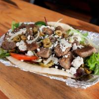 Lamb Gyro G · Sliced mix of seasoned lamb and beef roasted on a vertical spit-rotisserie.