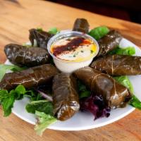 Side of Grape-Leaves · 8 stuffed pieces served with hummus .