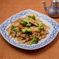 20. Broccoli Noodles (See-Ew). · Flat rice noodle with garlic, egg, broccoli, and carrots.