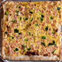 Western Breakfast Pizza · A square pie with ham, red onion, tomato, peppers, eggs and American cheese.