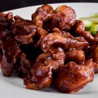 Boneless Spicy Buffalo Wings · Cooked with our own secret spice rub. Served mild, hot or BBQ.