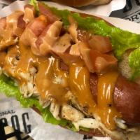 Surf and Turf Dog · Grilled 100% certified angus beef hot dog topped with jumbo lumped crab meat, lettuce, tomat...