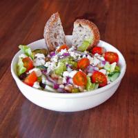 The Greek Salad · Romaine lettuce, cucumbers, olives, cherry tomatoes, chickpeas, feta cheese, red onion and o...