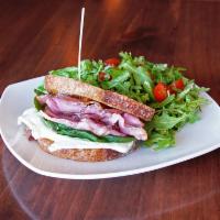 Ham, Brie and Fig Jam Sandwich · Ham, brie, basil, and fig jam on country bread. Served with arugula salad with pears, cherry...
