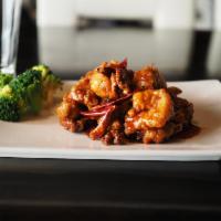 Dragon and Phoenix · Jumbo shrimp with dark meat chicken in General Tso's sauce.
top off with Walnuts 