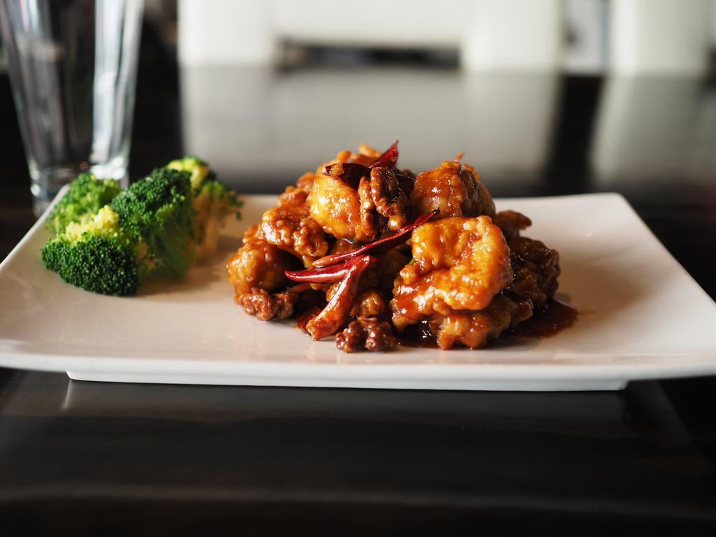 Dragon and Phoenix · Jumbo shrimp with dark meat chicken in General Tso's sauce.
top off with Walnuts 