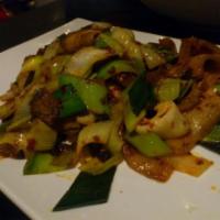 Double Cook Entree · Blanched and stir fried with giant leeks, beans and chili oil. 