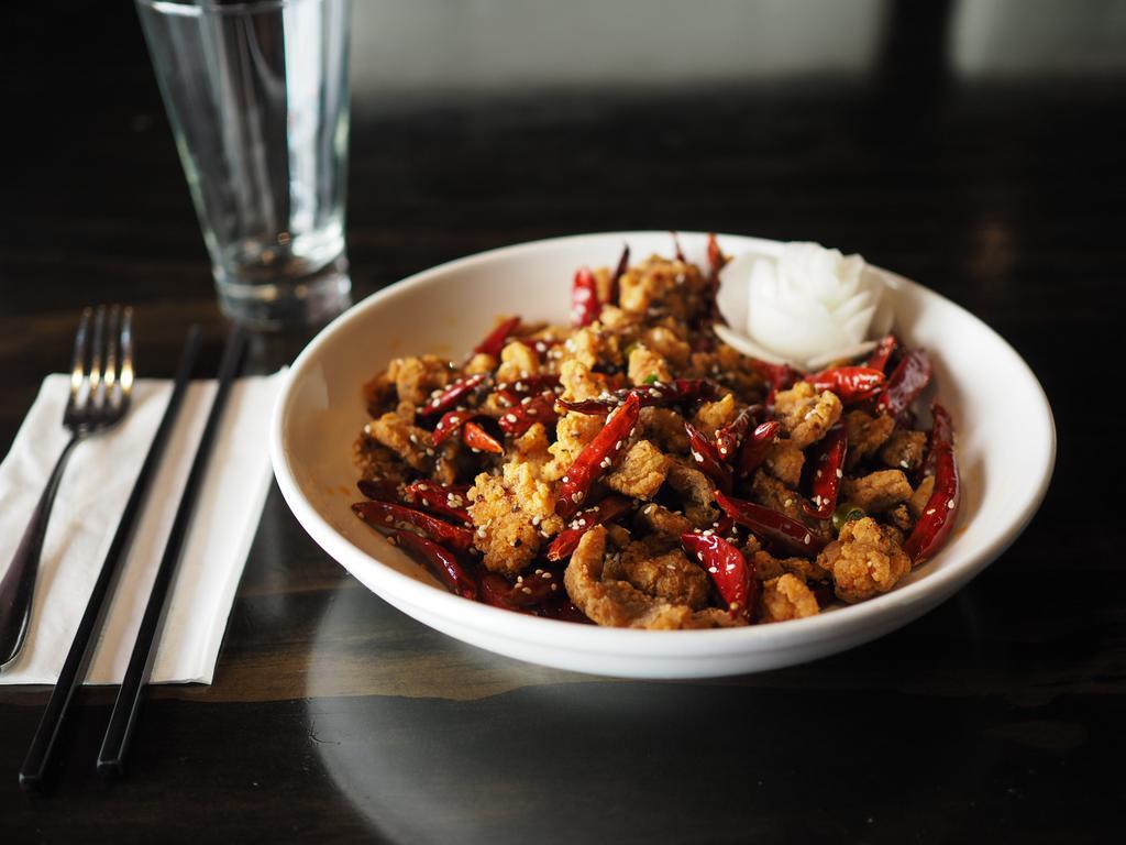 Dry Pepper Entree · Lightly breaded and stir fried with hot dry chili peppers for a crispy finish. 