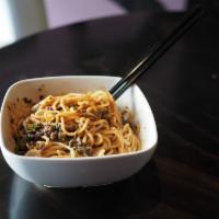 Jane's Dan Dan Noodles · Shanghai egg noodles, light soy sauce and topped with minced beef. Spicy. Contains peanut sa...